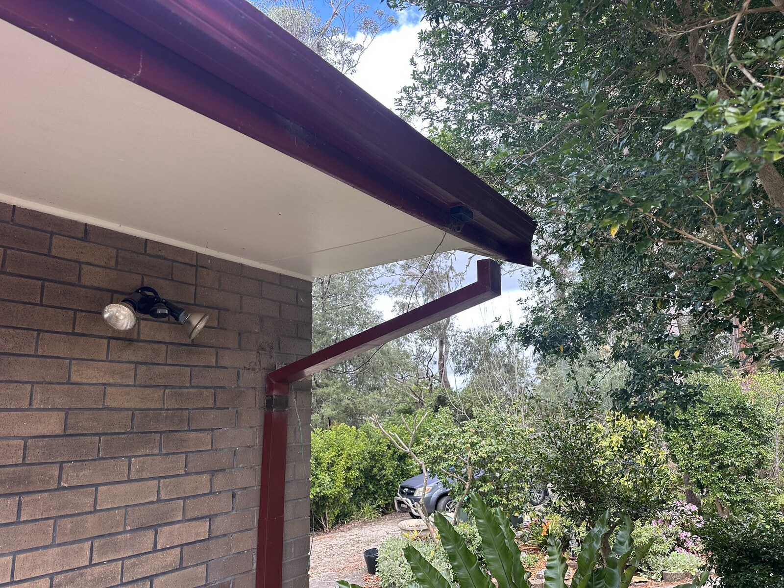 Downpipe disconnected from gutter during roof restoration